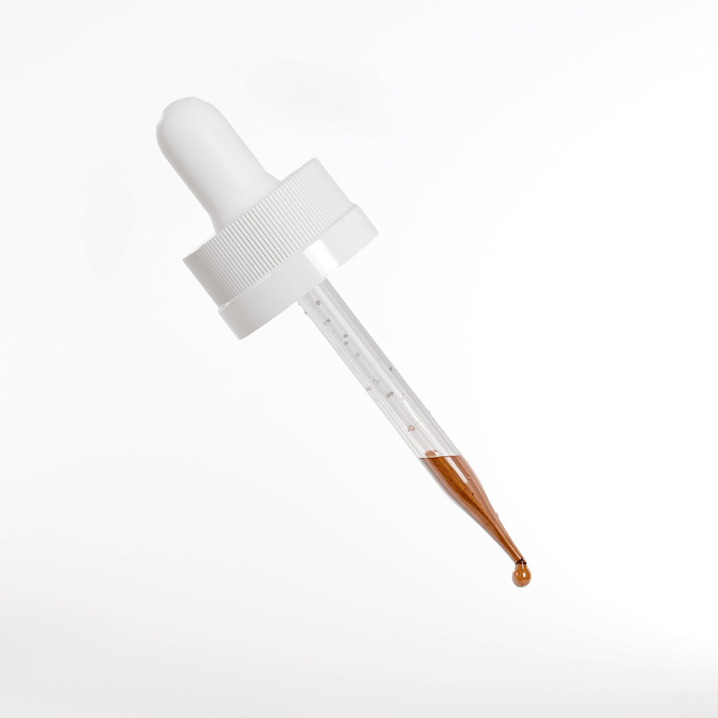 Peptide Hair Growth Serum dropper with clear liquid and golden tip on a white background.